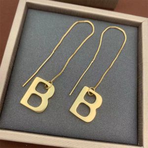 Balenciaga B Dangle Earrings In Gold