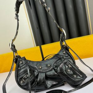 Balenciaga XS Le Cagole Shoulder Bag In Embossed Leather Black